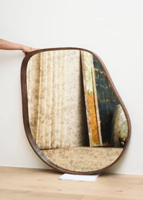 Types of Mirrors for Home Decor – A Complete Guide 3 Artistic wooden-framed mirror with organic shape perfect for modern or classic interiors