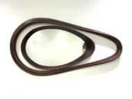 Wooden framed wall mirror with a unique asymmetric design.